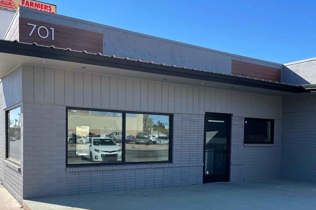 Casa Grande Nutrition storefront at 701 N Olive Ave, Casa Grande AZ — the 701 sign above the door, next to Farmers Insurance